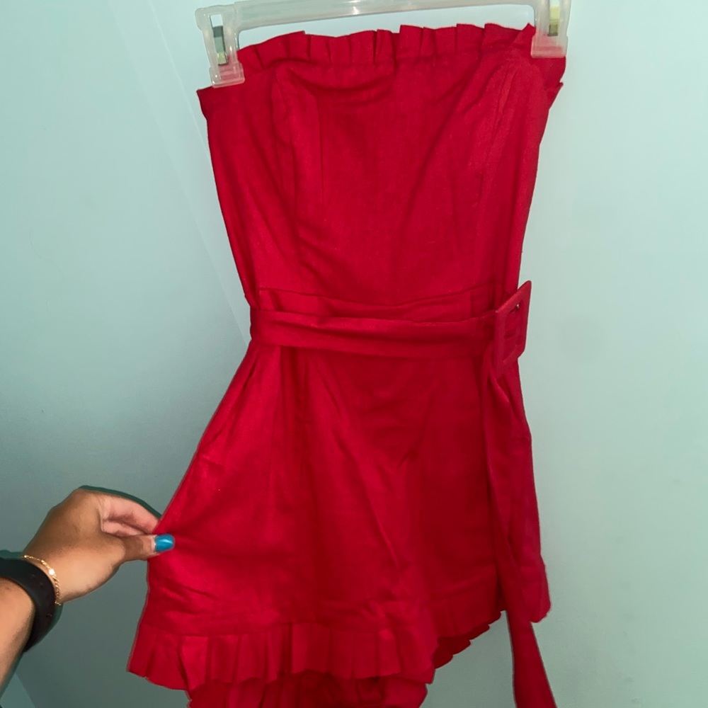 Red romper with belt.
